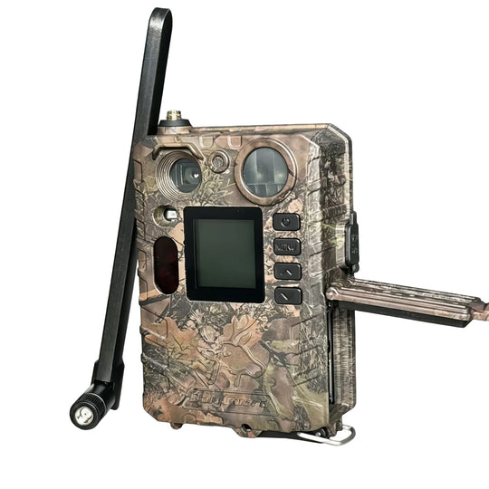 Camouflage cellular trail camera with long antenna, front display, control buttons, and attached solar panel for wildlife monitoring and property security