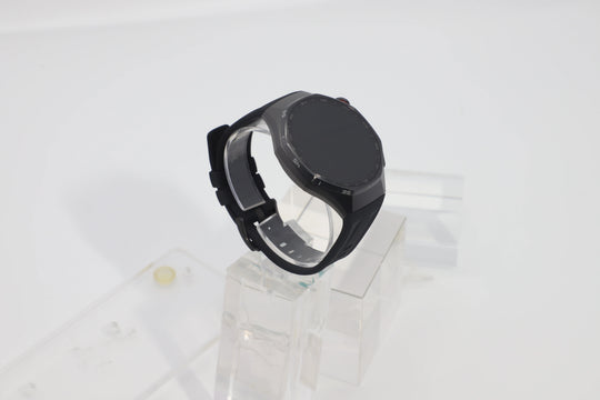 Black HUAWEI Watch GT 6 Pro 46mm GPS smartwatch with round screen and dark strap displayed on a clear stand