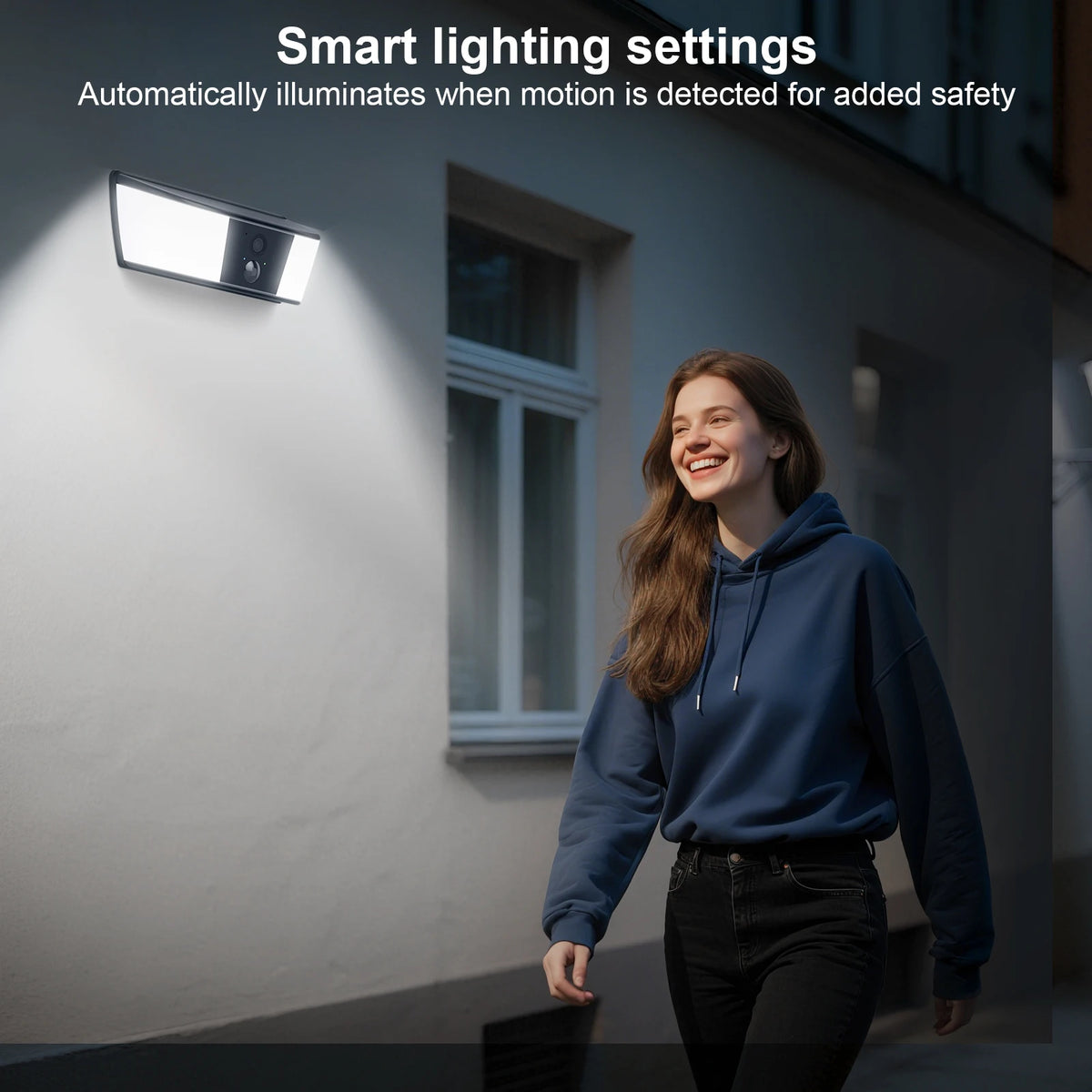 GPS outdoor wall light with built in camera illuminates a woman walking past a house, illustrating automatic motion activated lighting for added safety