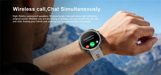 GPS rugged smartwatch on a wrist displaying a wireless call screen during an outdoor hike with mountain scenery in the background