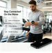 GPS smartwatch worn during treadmill exercise with built in microphone 7 day battery and health tracking shown beside a smartphone