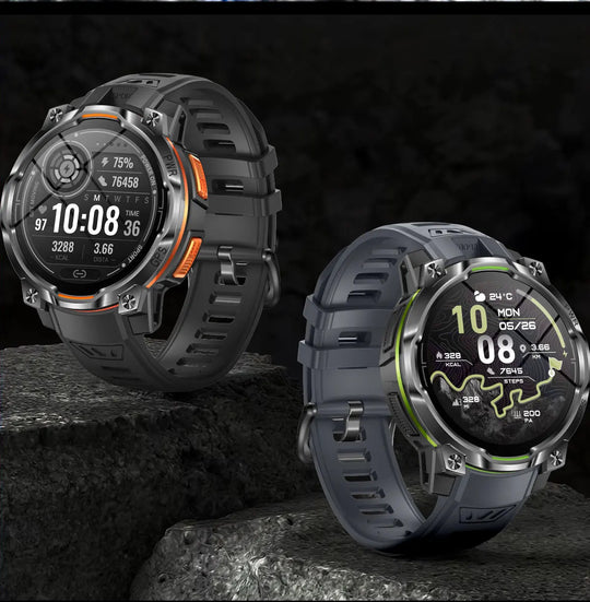 Two rugged GPS smartwatches with black straps and orange and green accents, displaying fitness data and navigation screens on rocky terrain